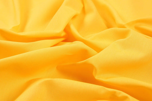 https://www.fabricsight.com/cdn/shop/files/Organic-Cotton-Poplin-43-Colors-Available-Fabric-fabricsight-Meters-Almost-Orange_512x342.jpg?v=1709119016