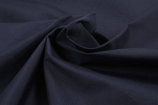 https://www.fabricsight.com/cdn/shop/files/Technical-Plain-Fabric-for-Swim-Shorts-NILITr-ECOCARE-Biodegradable-Polyamide-Fabric-fabricsight-Meters-Navy_512x342.jpg?v=1709128719