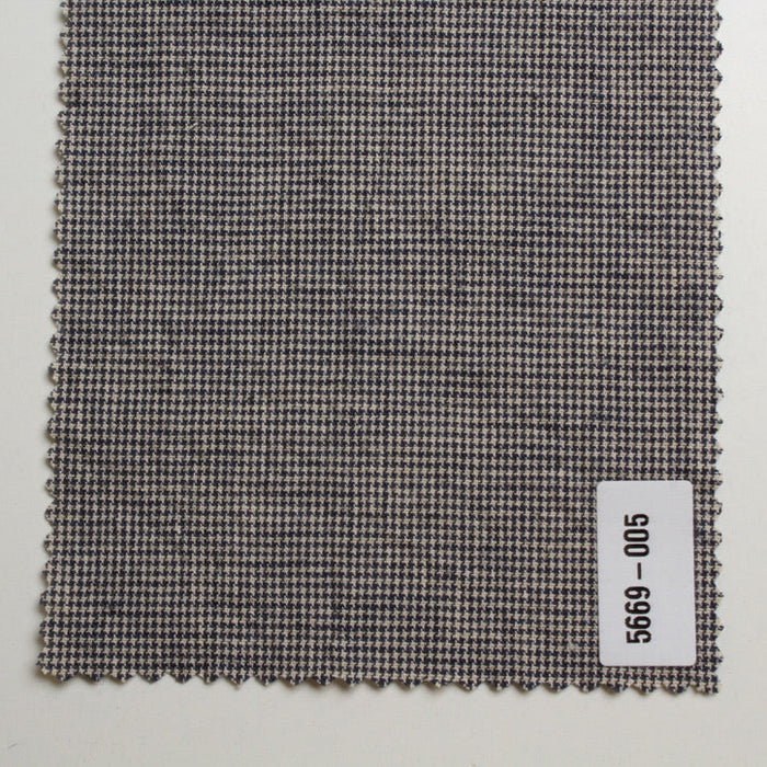 Textured fabric swatch with a label on a light gray background